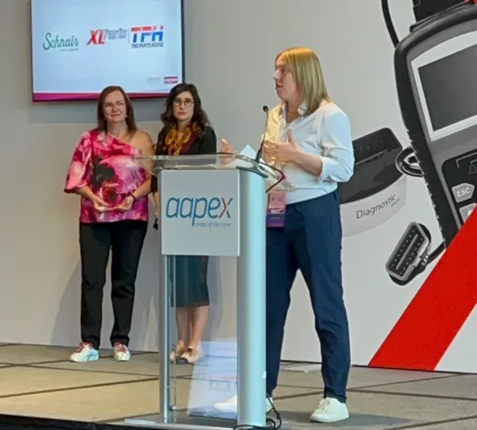 Lauren McCullough accepting an industry award at AAPEX