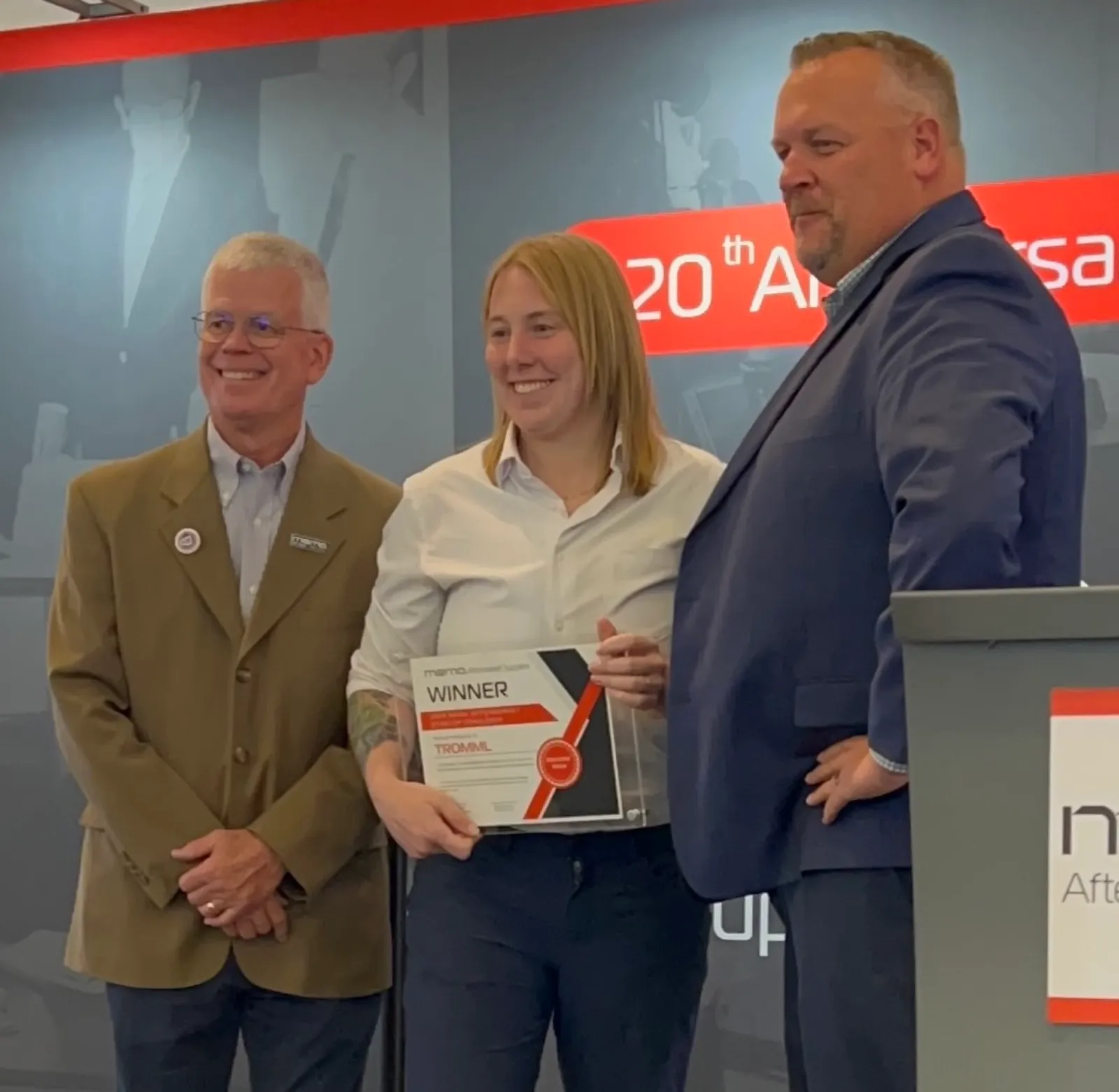 Tromml accepting the MEMA Startup Challenge winner award, 2024